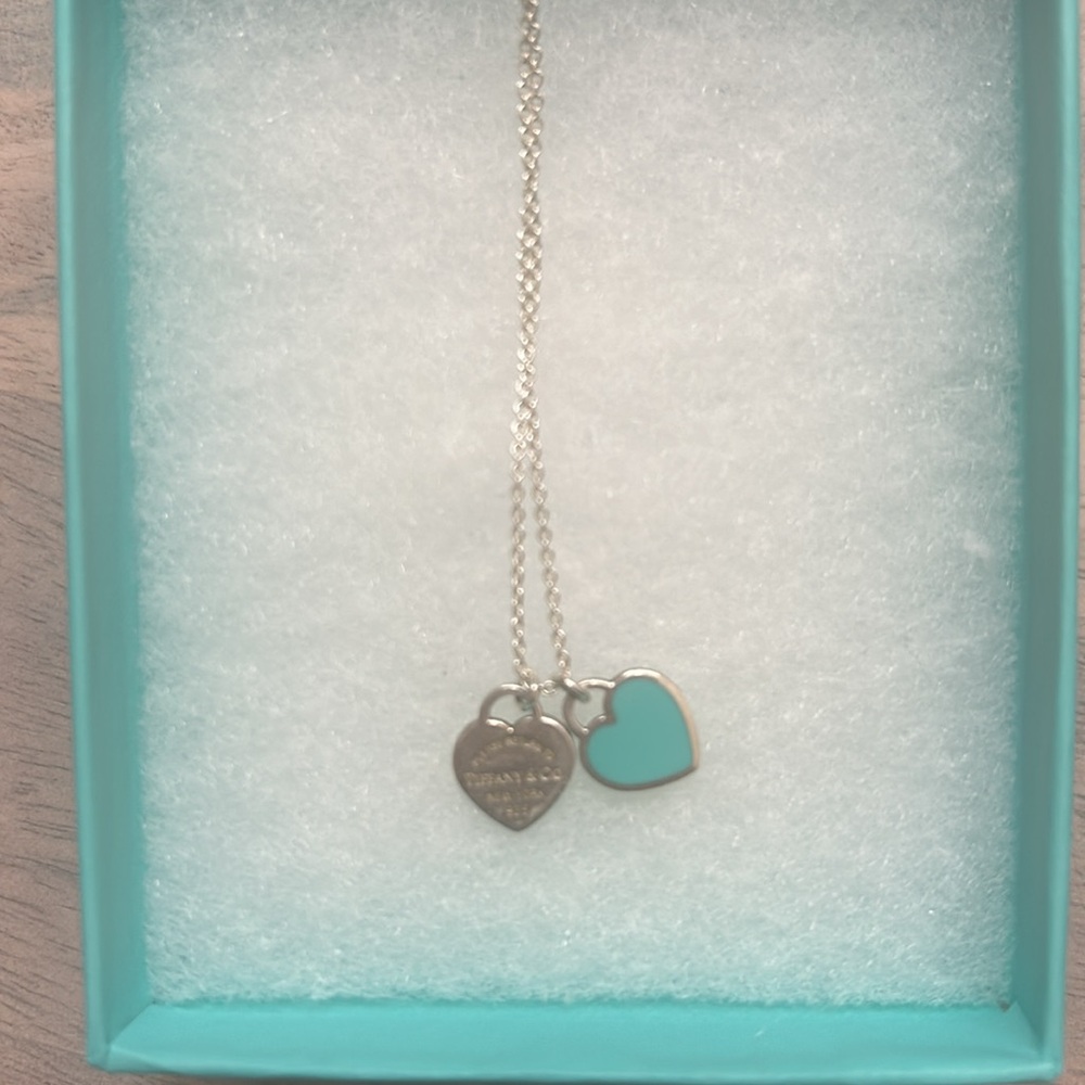 This is a Tiffany and co return to Tiffany blue double heart pendent never worn.